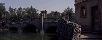 Movie still from “Désirée” (1954), directed by Henry Koster – A stone bridge over a body of water; Wide shot, High angle