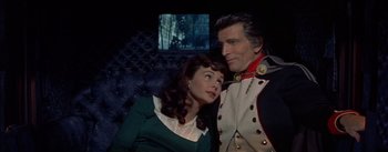 Movie still from “Désirée” (1954), directed by Henry Koster – A man and a woman sitting next to each other; Medium shot, High angle