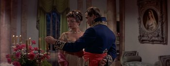 Movie still from “Désirée” (1954), directed by Henry Koster – A man and a woman dressed in formal wear; Medium shot, Over the shoulder angle