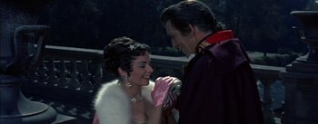 Movie still from “Désirée” (1954), directed by Henry Koster – A man and a woman are smiling at each other; Medium shot, Over the shoulder angle