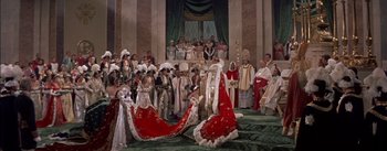 Movie still from “Désirée” (1954), directed by Henry Koster – A large group of people dressed up in costumes; Extreme Wide shot, High angle
