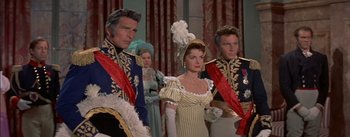 Movie still from “Désirée” (1954), directed by Henry Koster – A group of people standing next to each other in costumes; Medium shot, Low angle