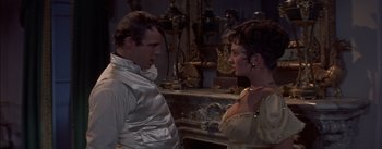 Movie still from “Désirée” (1954), directed by Henry Koster – A man and a woman talking in front of a fireplace; Medium shot, Over the shoulder angle