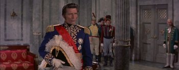 Movie still from “Désirée” (1954), directed by Henry Koster – A group of men standing next to each other in uniforms; Medium shot, Over the shoulder angle