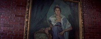 Movie still from “Désirée” (1954), directed by Henry Koster – A painting of a woman wearing a crown and holding a chair; Medium shot, Low angle