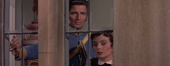 Movie still from “Désirée” (1954), directed by Henry Koster – A man and a woman looking through a window; Close Up shot, Over the shoulder angle