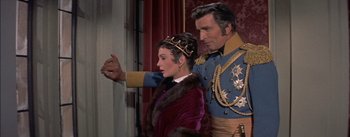 Movie still from “Désirée” (1954), directed by Henry Koster – A man and a woman dressed up in costume; Medium shot, Over the shoulder angle