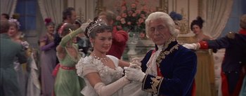 Movie still from “Désirée” (1954), directed by Henry Koster – An old man and a young woman dancing in a ballroom; Medium shot, High angle