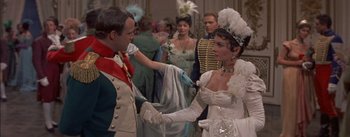 Movie still from “Désirée” (1954), directed by Henry Koster – A man and a woman dressed in period costumes; Medium shot, Over the shoulder angle