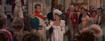 Movie still from “Désirée” (1954), directed by Henry Koster – A man and a woman dressed up in formal wear; Medium shot, Over the shoulder angle