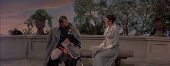 Movie still from “Désirée” (1954), directed by Henry Koster – A man and a woman sitting on a bench; Medium shot, Over the shoulder angle