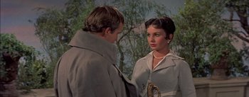 Movie still from “Désirée” (1954), directed by Henry Koster – A man and a woman standing next to each other in front of a tree; Close Up shot, Over the shoulder angle