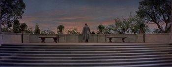 Movie still from “Désirée” (1954), directed by Henry Koster – A man standing on a set of steps looking at the sky; Extreme Wide shot, Low angle