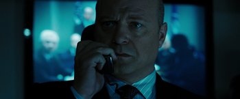 Movie still from “Eagle Eye” (2008), directed by D.J. Caruso – A person talking on a cell phone; Close Up shot, Low angle