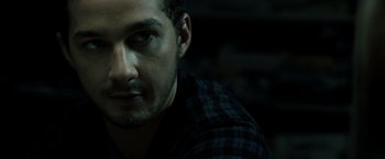 Movie still from “Eagle Eye” (2008), directed by D.J. Caruso – A person wearing a shirt; Close Up shot, Over the shoulder angle