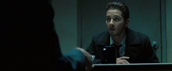 Movie still from “Eagle Eye” (2008), directed by D.J. Caruso – A man looking at himself in the mirror in front of a mirror; Close Up shot, Over the shoulder angle