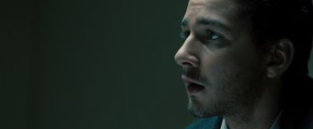 Movie still from “Eagle Eye” (2008), directed by D.J. Caruso – A man's face with a beard; Close Up shot, Low angle