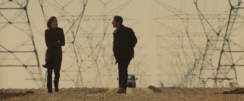 Movie still from “Eagle Eye” (2008), directed by D.J. Caruso – A man standing in the middle of a road; Wide shot, Low angle