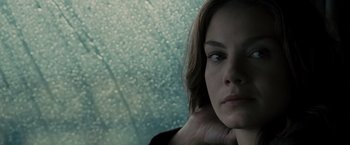 Movie still from “Eagle Eye” (2008), directed by D.J. Caruso – A person with her hand on her chin; Close Up shot, Low angle