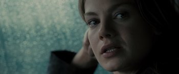 Movie still from “Eagle Eye” (2008), directed by D.J. Caruso – A woman's face in a room; Close Up shot, Over the shoulder angle