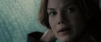 Movie still from “Eagle Eye” (2008), directed by D.J. Caruso – A woman's face in a dark room; Close Up shot, Over the shoulder angle