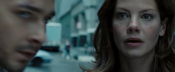 Movie still from “Eagle Eye” (2008), directed by D.J. Caruso – A woman's face in a city street; Close Up shot, Low angle