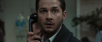 Movie still from “Eagle Eye” (2008), directed by D.J. Caruso – A person holding a cell phone; Close Up shot, High angle