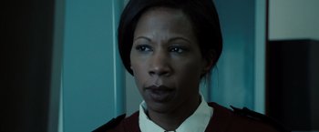 Movie still from “Eagle Eye” (2008), directed by D.J. Caruso – A person wearing a shirt and tie; Close Up shot, Low angle