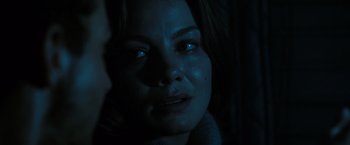 Movie still from “Eagle Eye” (2008), directed by D.J. Caruso – A woman's face in the dark; Close Up shot, Over the shoulder angle
