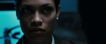 Movie still from “Eagle Eye” (2008), directed by D.J. Caruso – A woman's face in a dark room; Close Up shot, Low angle