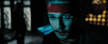 Movie still from “Eagle Eye” (2008), directed by D.J. Caruso – A person with a red strip on his forehead; Extreme Close Up shot, High angle