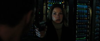 Movie still from “Eagle Eye” (2008), directed by D.J. Caruso – A woman holding a glass of wine in a dimly - lit room; Close Up shot, Low angle