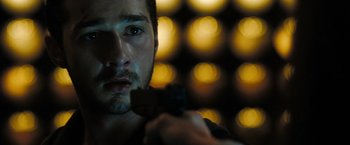 Movie still from “Eagle Eye” (2008), directed by D.J. Caruso – A person holding a gun; Close Up shot, Over the shoulder angle