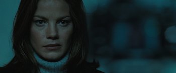 Movie still from “Eagle Eye” (2008), directed by D.J. Caruso – A woman's face in the dark; Close Up shot, Low angle