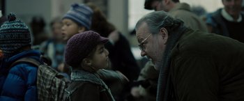 Movie still from “Eagle Eye” (2008), directed by D.J. Caruso – An older man talking to a young girl; Close Up shot, Over the shoulder angle