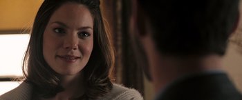 Movie still from “Eagle Eye” (2008), directed by D.J. Caruso – A person smiling at the camera; Close Up shot, Over the shoulder angle