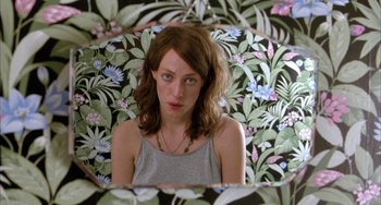 Movie still from “Eagle vs Shark” (2007), directed by Taika Waititi – A woman standing in front of a mirror; Close Up shot, Overhead angle