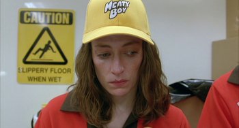 Movie still from “Eagle vs Shark” (2007), directed by Taika Waititi – A woman wearing a yellow hat and a red jacket; Close Up shot, Low angle