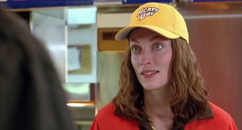 Movie still from “Eagle vs Shark” (2007), directed by Taika Waititi – A person wearing a hat; Close Up shot, Over the shoulder angle