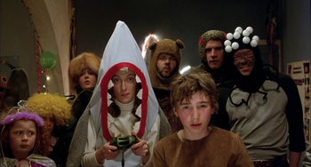 Movie still from “Eagle vs Shark” (2007), directed by Taika Waititi – A group of people dressed up in costumes; Medium shot, High angle