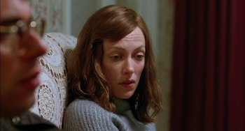 Movie still from “Eagle vs Shark” (2007), directed by Taika Waititi – A person sitting on a chair; Close Up shot, High angle