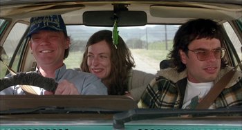 Movie still from “Eagle vs Shark” (2007), directed by Taika Waititi – A group of people riding in the back of a car; Medium shot, Low angle