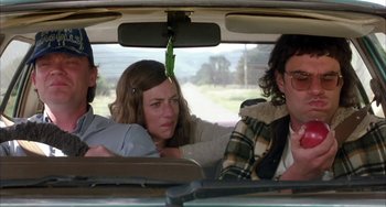 Movie still from “Eagle vs Shark” (2007), directed by Taika Waititi – A group of people sitting in the back of a car; Medium shot, Low angle