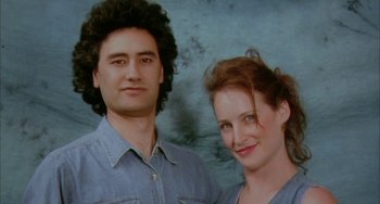 Movie still from “Eagle vs Shark” (2007), directed by Taika Waititi – A man and a woman standing next to each other; Close Up shot, Low angle