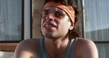 Movie still from “Eagle vs Shark” (2007), directed by Taika Waititi – A person wearing glasses and a headband; Close Up shot, Low angle