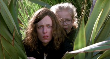 Movie still from “Eagle vs Shark” (2007), directed by Taika Waititi – A woman and a child in a field; Close Up shot, Low angle