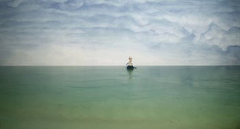 Movie still from “Eagle vs Shark” (2007), directed by Taika Waititi – A person on a boat in the middle of the ocean; Extreme Wide shot, Low angle