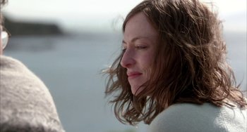 Movie still from “Eagle vs Shark” (2007), directed by Taika Waititi – A person with long brown hair; Close Up shot, Over the shoulder angle