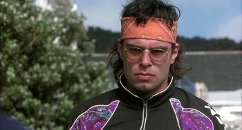 Movie still from “Eagle vs Shark” (2007), directed by Taika Waititi – A man with a bandana on his head and glasses; Close Up shot, Low angle