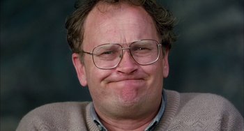 Movie still from “Eagle vs Shark” (2007), directed by Taika Waititi – A person wearing glasses and a sweater; Close Up shot, Low angle